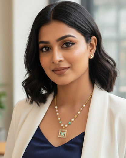 Elegant Pearl & Stone Butterfly Pendant Necklace – Gold Plated